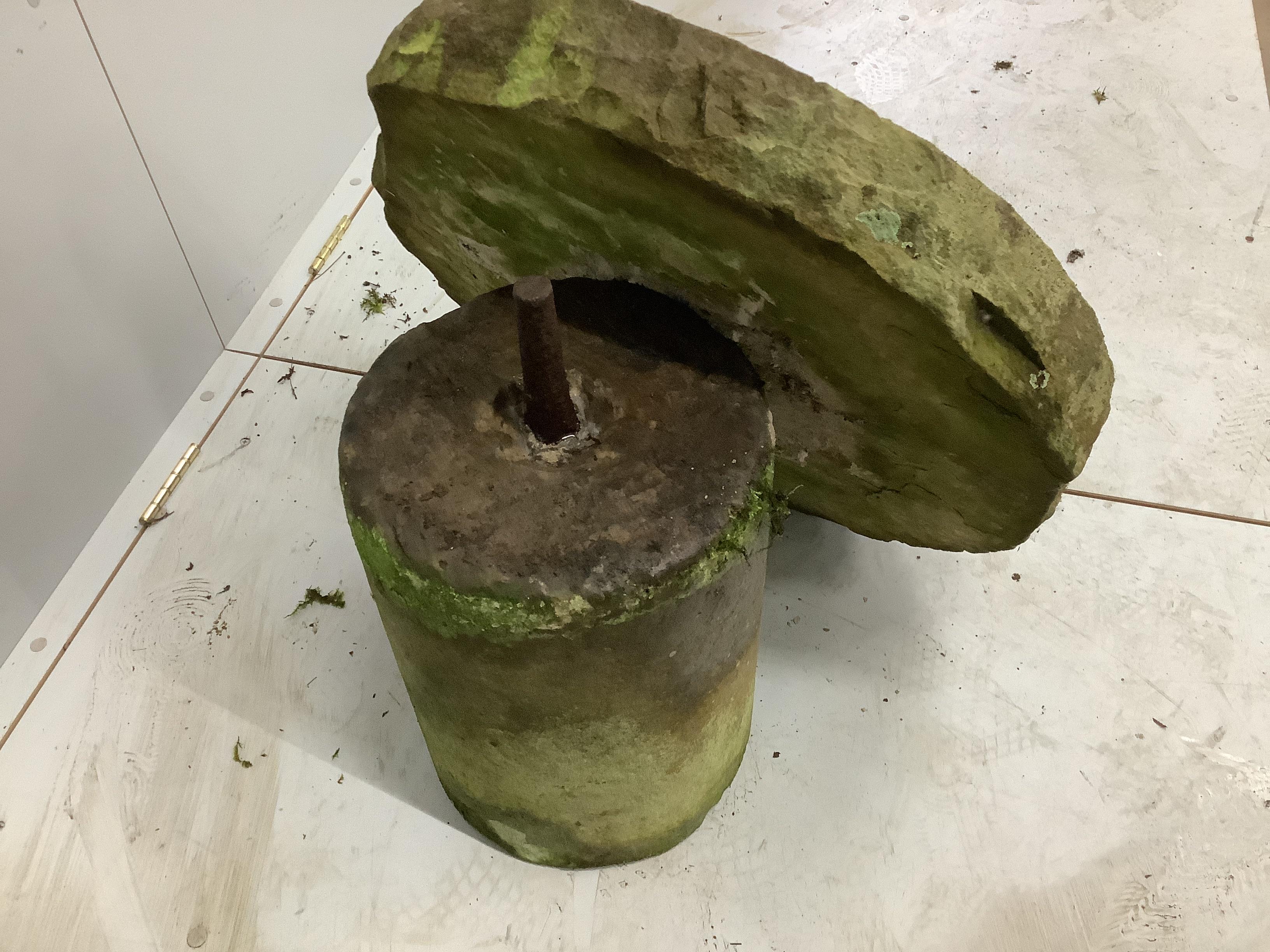 A circular millstone table, diameter 62cm, height 47cm